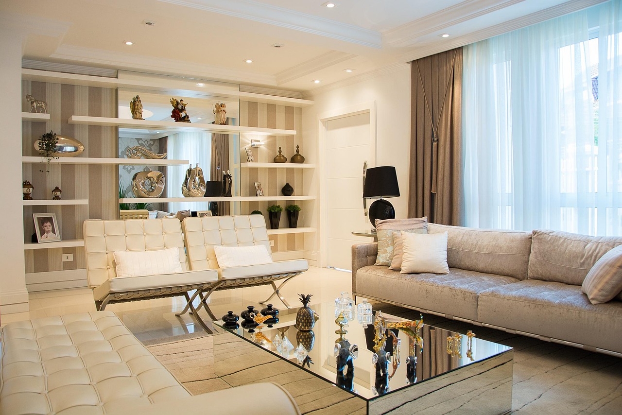 An elegant, well presented living room with a cream sofa and warm lighting